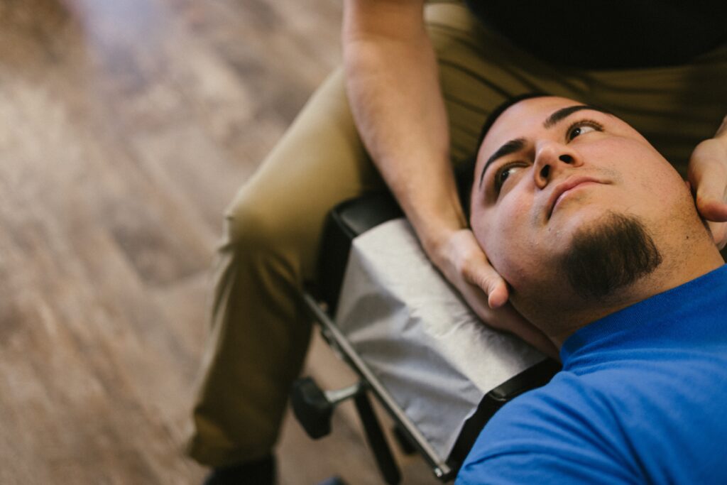 A visual representation of a chiropractor applying a specific adjustment technique to the cervical spine of a patient, aiming to restore alignment and mobility.